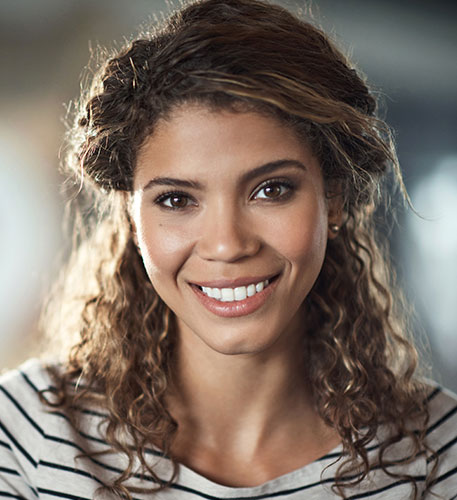 smiling young woman in a striped shirt