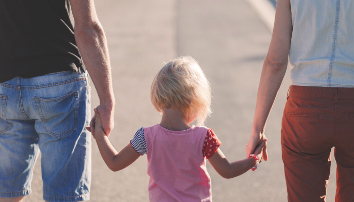 family walking towards the dentist's office