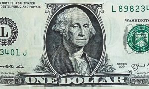 The face of George Washington, the first U.S. president, on a green one dollar bill