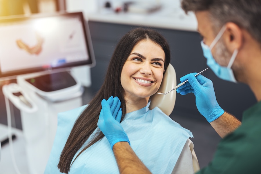 smiling woman at a dentist near me